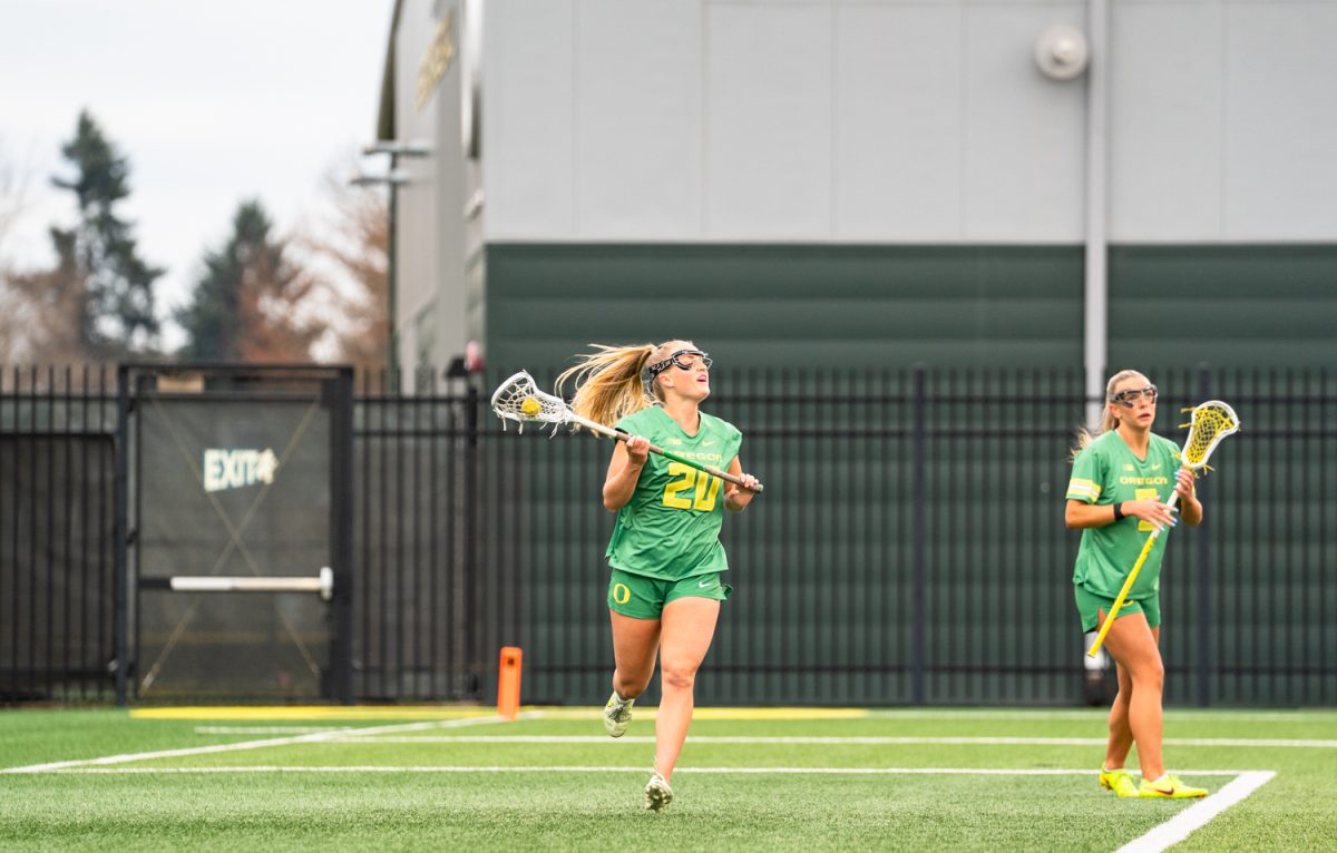 Senior attacker Emma Ing (20) looks to pass to a teammate. On Feb. 7th, 2026 the University of Oregon women's lacrosse team hosted a season-opening game against Arizona State University on Papé Field in Eugene, Ore. (Katie Poluyansky/Emerald)