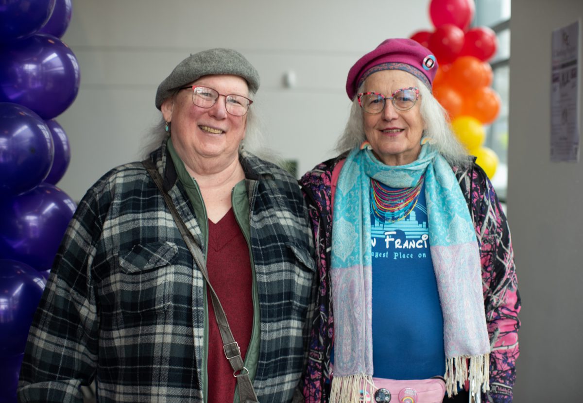 Rebecca Thompson, a community member (left) and Liz Laventure (right), a volunteer administrative assistant at the Lavender Center, pose for a photo as they celebrate it’s ribbon cutting ceremony. Liz cheerfully greeted guests at the door and signed them in for this event, which lasted about an hour. The Lavender Center in Eugene, Ore, an LGBTQ+ resource center, celebrates its opening to the public with a ribbon-cutting ceremony on February 10th, 2026. (Chris Castro/Emerald)