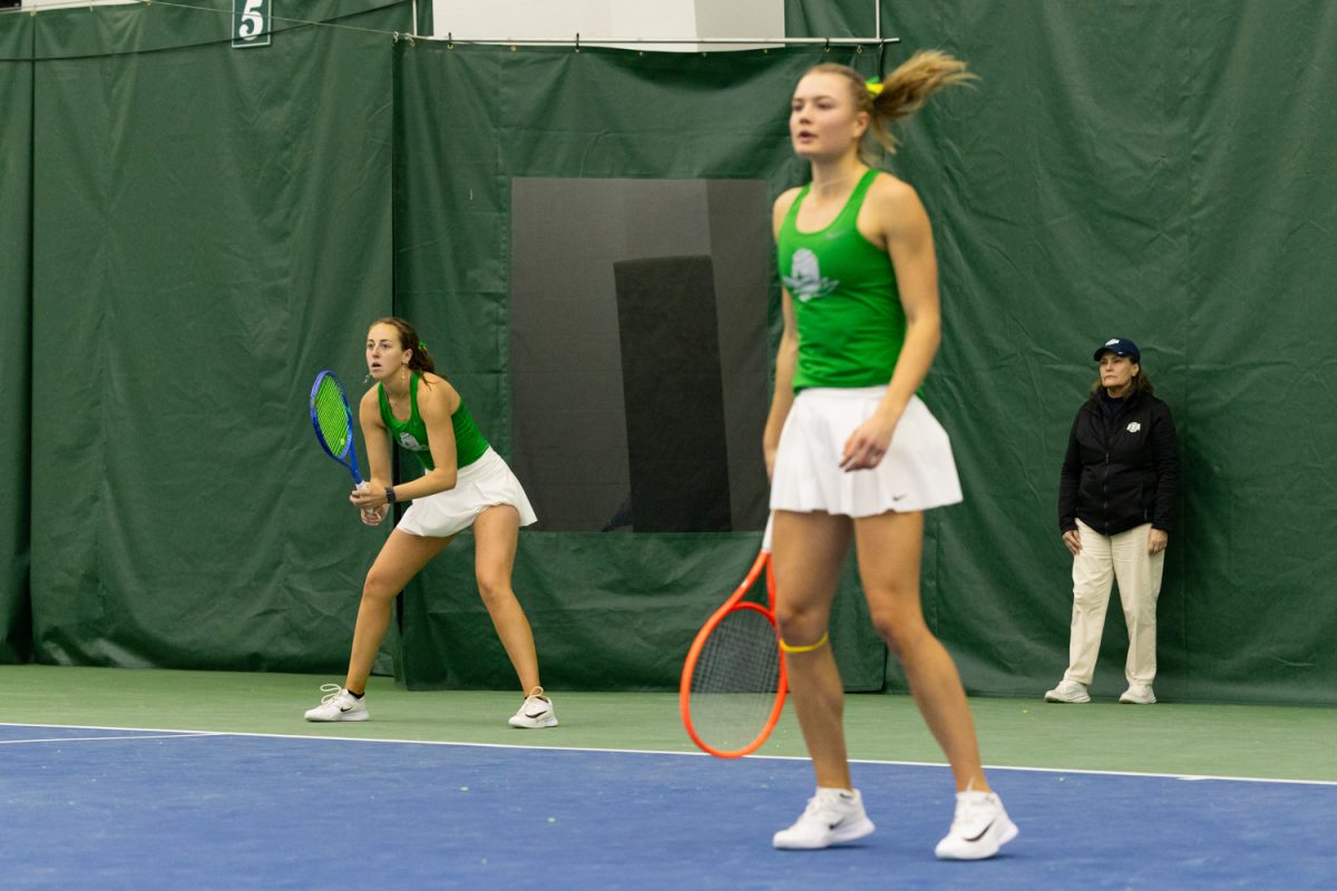 Doubles partners Olivia Symons (Left) and Tilde Jagare (Right) prepare to return a serve. University of Oregon wins its second match of the day against Seattle University after defeating UC Riverside earlier at the Student Tennis Center in Eugene, Ore. on February 14, 2026. (Owen Burriss/Emerald)