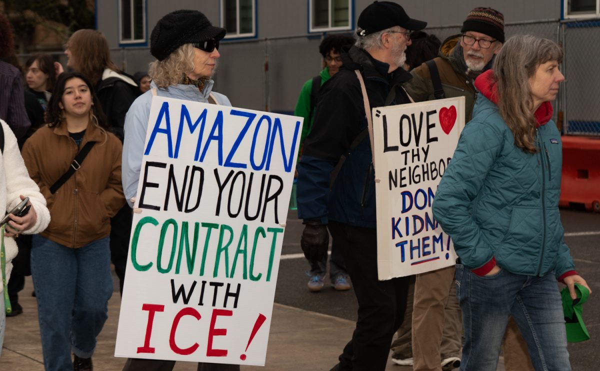 Protestors make their way to the Erb Memorial Union from Johnson while continuing to chant and wave their signs. Around 12 p.m. approximately 100 students, local Eugene residents, and ICE protestors crowded in the front of Johnson administration building on the University of Oregon campus in Eugene, Ore. on Feb 16. 2026. The protest on President's Day calls out the University of Oregon administration for making immigrant students feel unsafe. (Katie Poluyansky/Emerald)