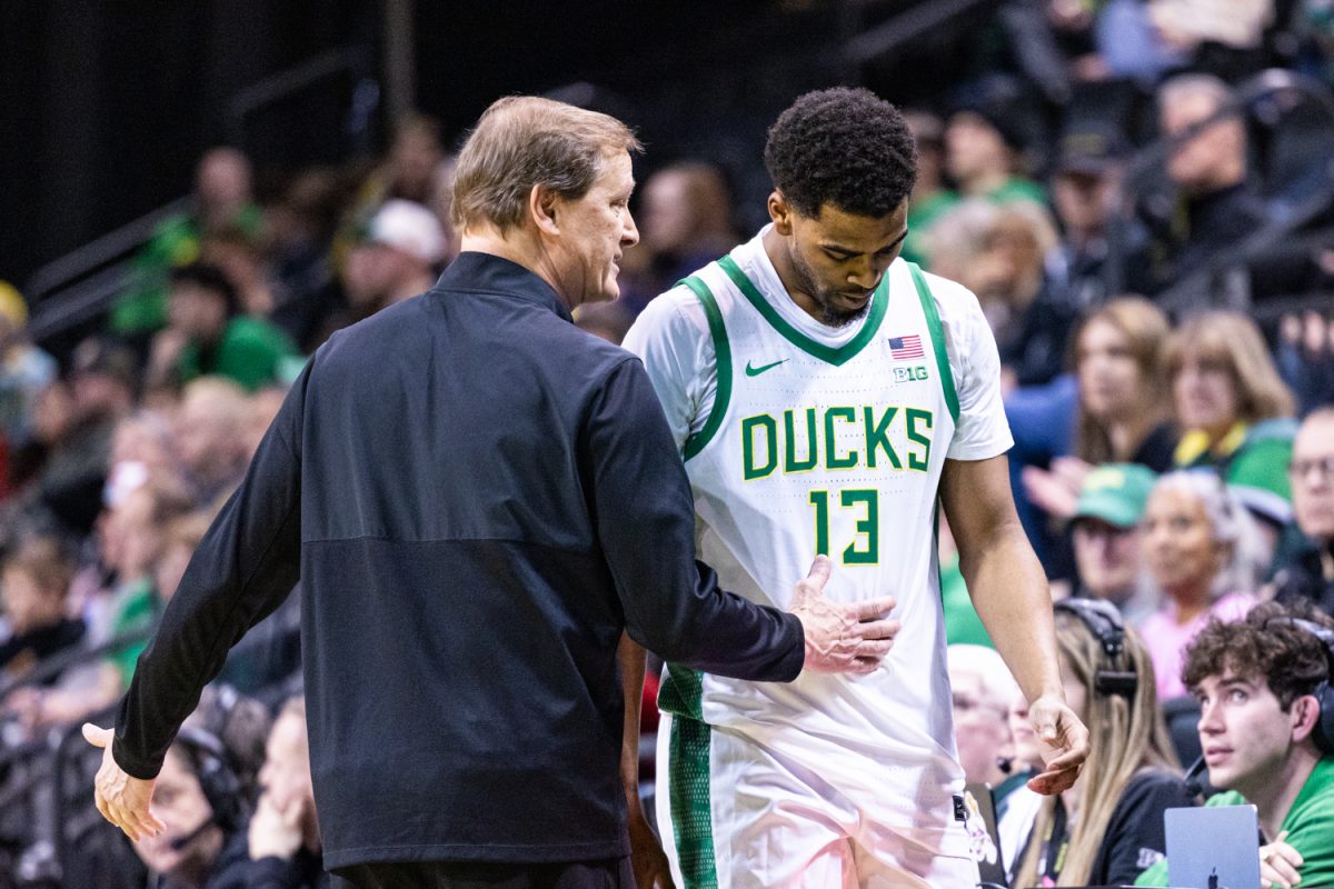 Oregon coach Dana Altman talks to forward Sean Stewart (13) as he comes off the court. The Oregon Ducks men’s basketball hosted the Minnesota Golden Gophers at Matthew Knight Arena in Eugene, Ore. on Feb. 17, 2026, losing 44-61. (Owen Burriss/Emerald)