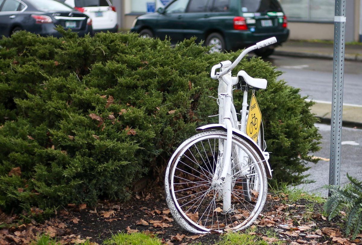 A “Ghost Bike” commemorating the loss of cyclist David Minor sits on the corner of 13th Avenue and Willamette Street in Eugene, Ore., on February 16, 2026 (Tyler Graham/Emerald)