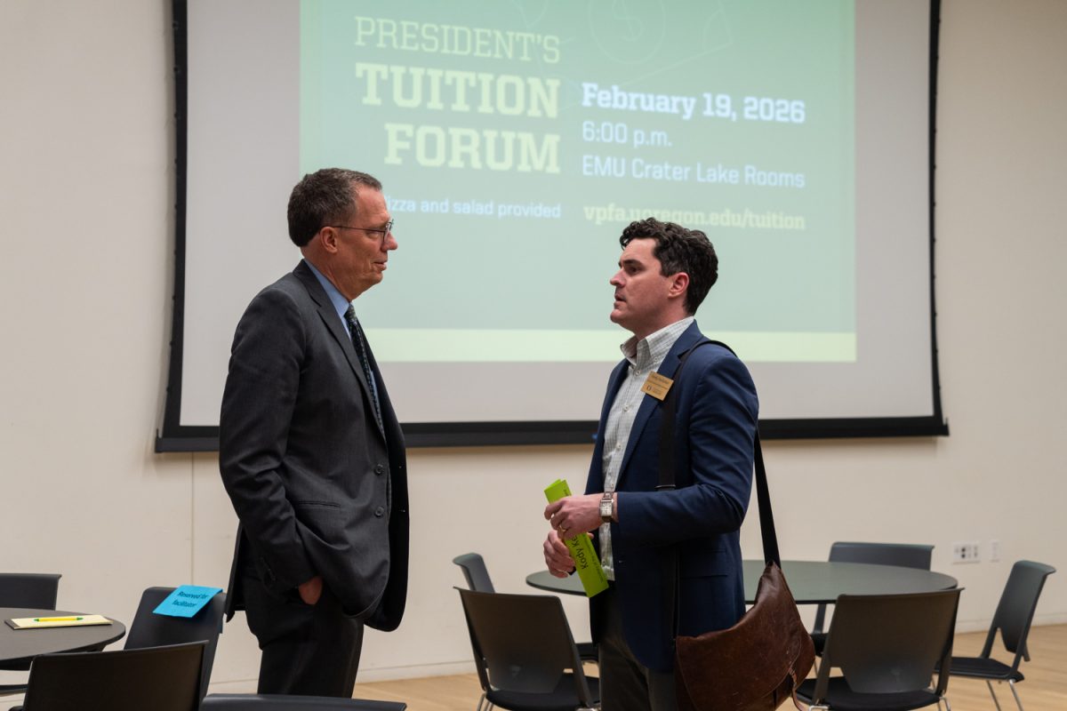 University of Oregon 
President Karl Scholz talks with advisor Kody Kellher before the Presidents Tuition Forum in the Erb Memoral Union in Eugene, Ore., on Feb. 19, 2026. (Rowan Campbell/Emerald).