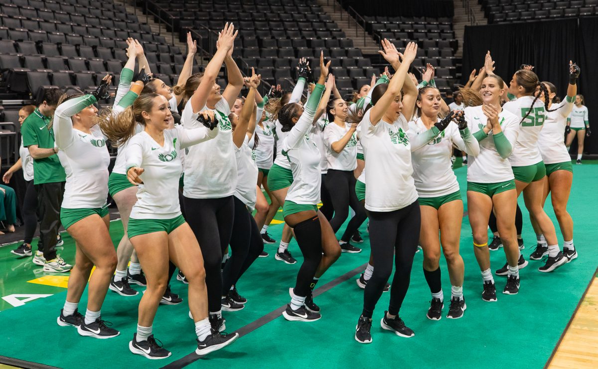 The Oregon Acro and Tumbling team dance during "Shout" an Oregon tradition. The Oregon Acro and Tumbling team perform their routine during the team event. The Oregon Acro and Tumbling team took on the No. 3 Quinnipiac University at Matthew Knight Arena in Eugene, Ore. on Feb 21, 2025, winning 270.640 to 265.425. (Saj Sundaram/Emerald)