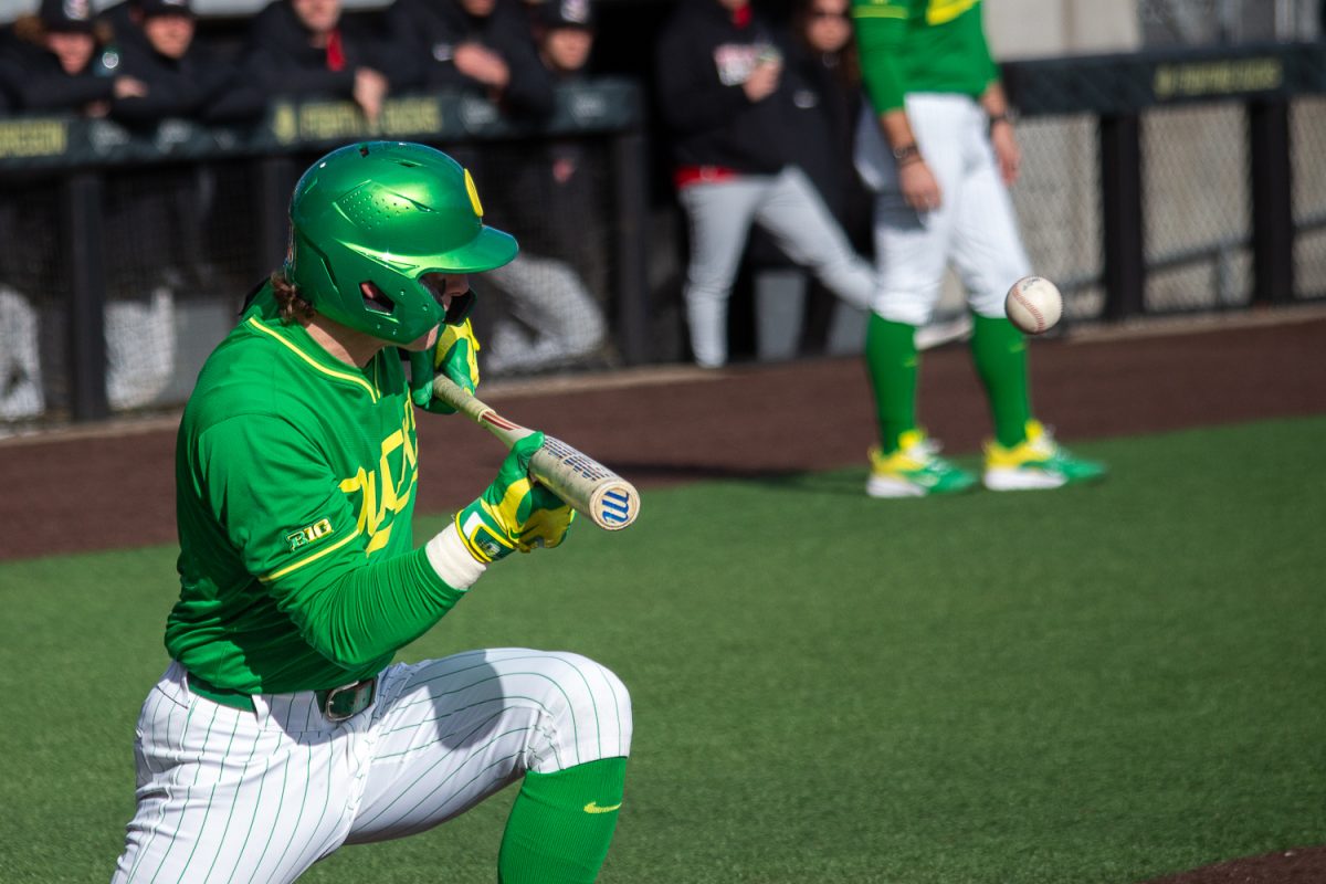Oregon catcher Burke-Lee Mabeus (5) bunts the ball to get on base. On February 19, 2025 the Oregon Ducks started off their second series of the season, playing the Youngstown State Penguins at PK Park, at University of Oregon, based in Eugene, Ore. (Fred Hall/Emerald)