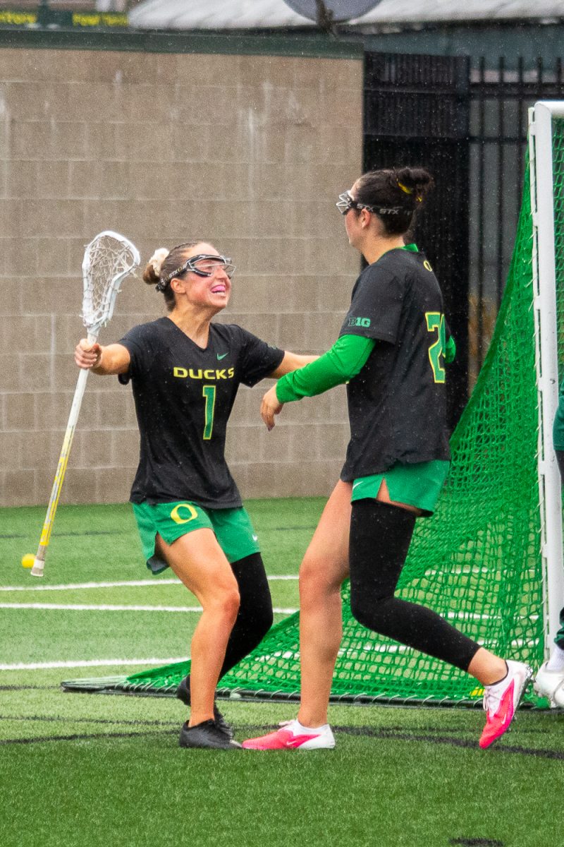 Oregon middle Rachel Pallo (1) celebrates with Oregon attacker Lyla Hurley (25) after her goal. On February 22, 2026, the University of Oregon Ducks took a close loss to the Eastern Michigan University Eagles at Papé Field, at University of Oregon, based in Eugene, Ore. (Fred Hall/Emerald)