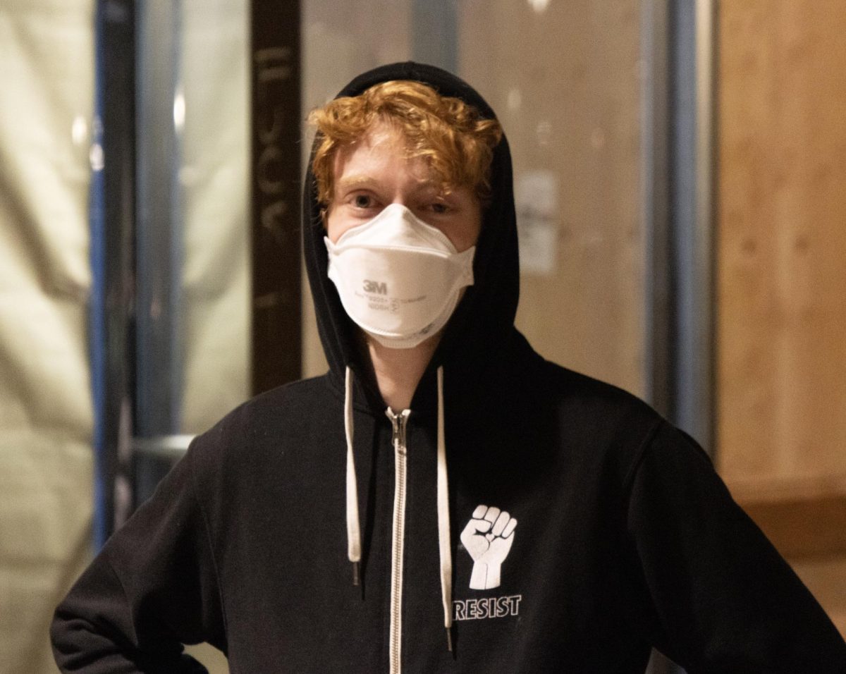 A University of Oregon student protests at the the Eugene Federal Building on Monday, Feb. 2, 2026. (Tarek Anthony/Emerald)