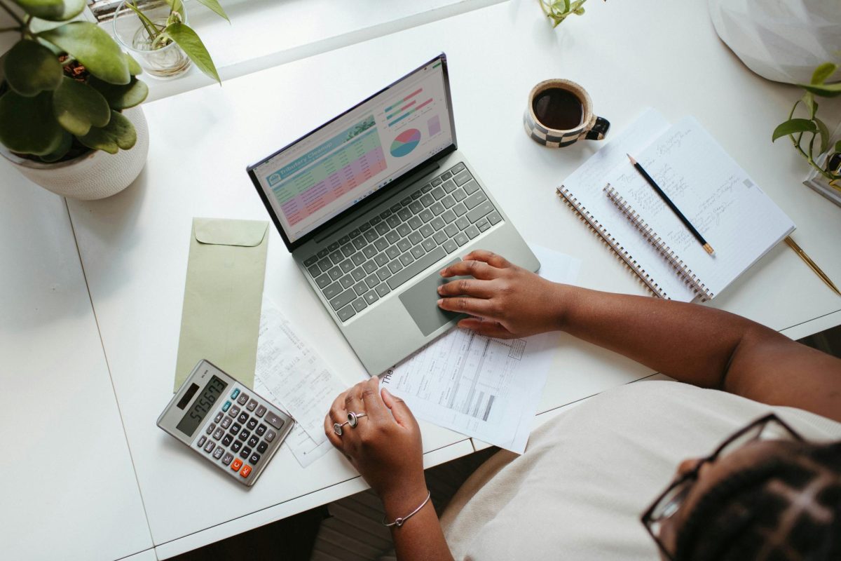 https://unsplash.com/photos/a-person-sitting-at-a-table-with-a-laptop-oUbzU87d1Gc