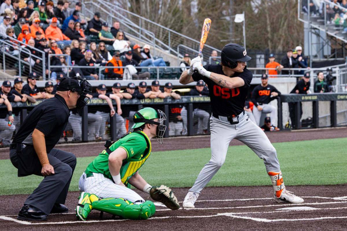 Oregon catcher Brayden Jaksa (11) and Oregon State right fielder Adam Haight (4) prepare for a pitch. Oregon Duck baseball hosted in-state rivals the Oregon State Beavers at PK Park in Eugene, Ore. on March 3, 2026, losing 10-6. (Owen Burriss/Emerald)