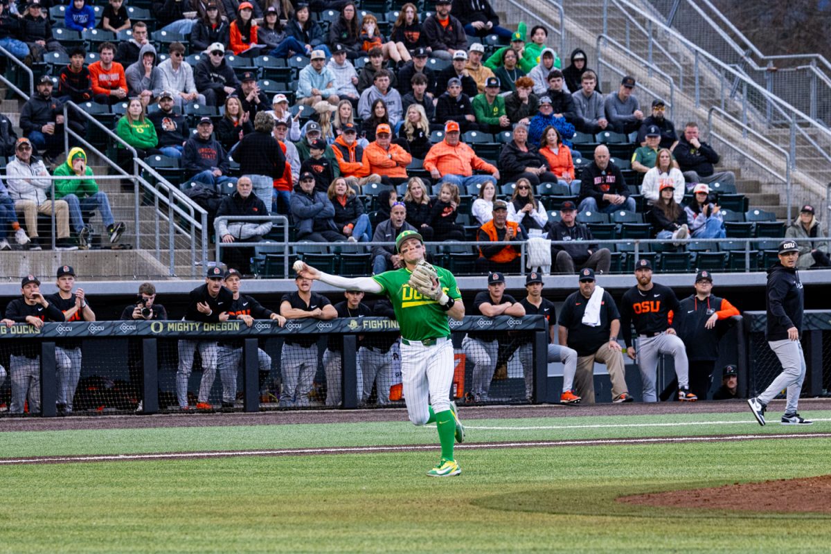 Duck third baseman Drew Smith (17) sidearms a throw to first base. Oregon Duck baseball hosted in-state rivals the Oregon State Beavers at PK Park in Eugene, Ore. on March 3, 2026, losing 10-6. (Owen Burriss/Emerald)