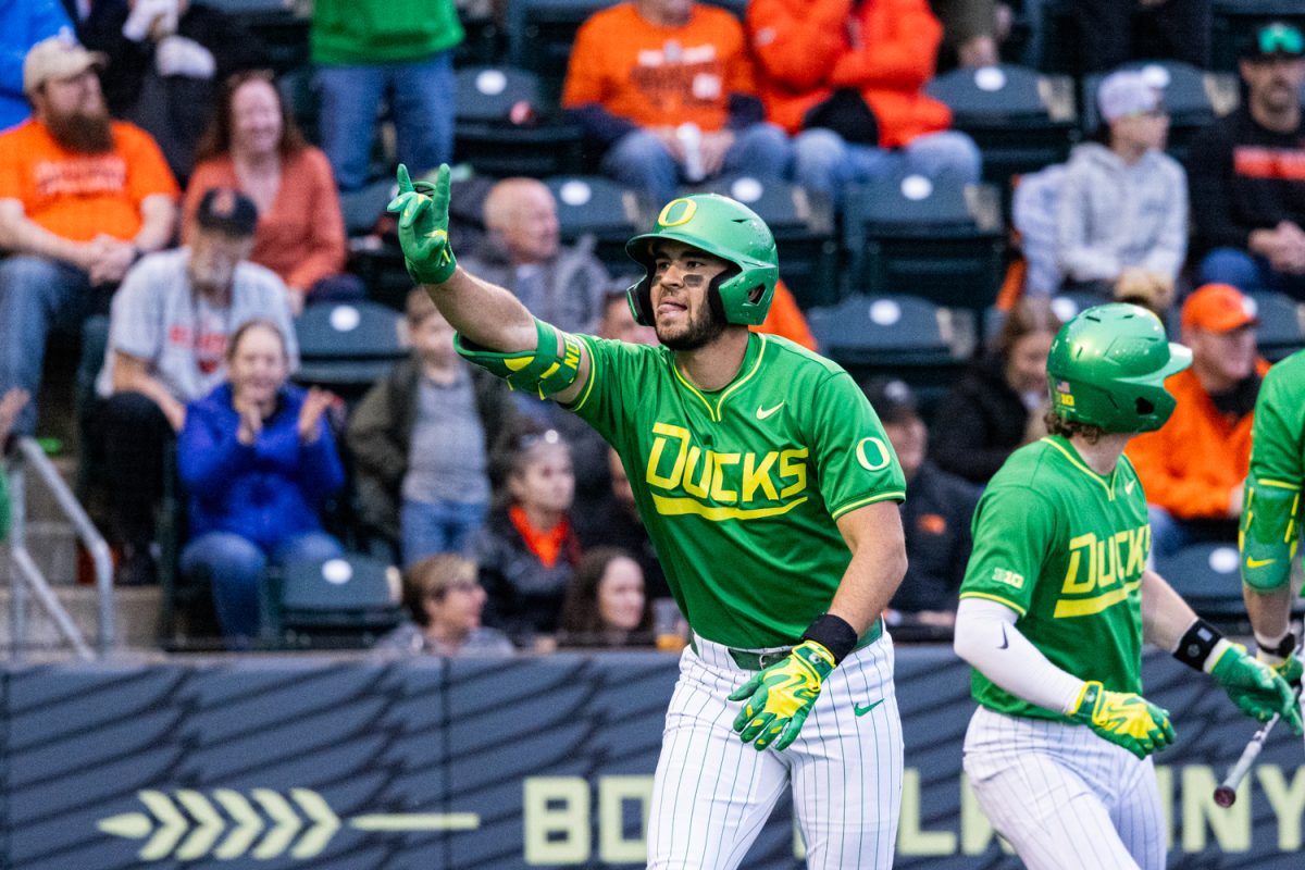 Oregon freshman Angel Laya signals toward the dugout after hitting a home run. Oregon Duck baseball hosted in-state rivals the Oregon State Beavers at PK Park in Eugene, Ore. on March 3, 2026, losing 10-6. (Owen Burriss/Emerald)