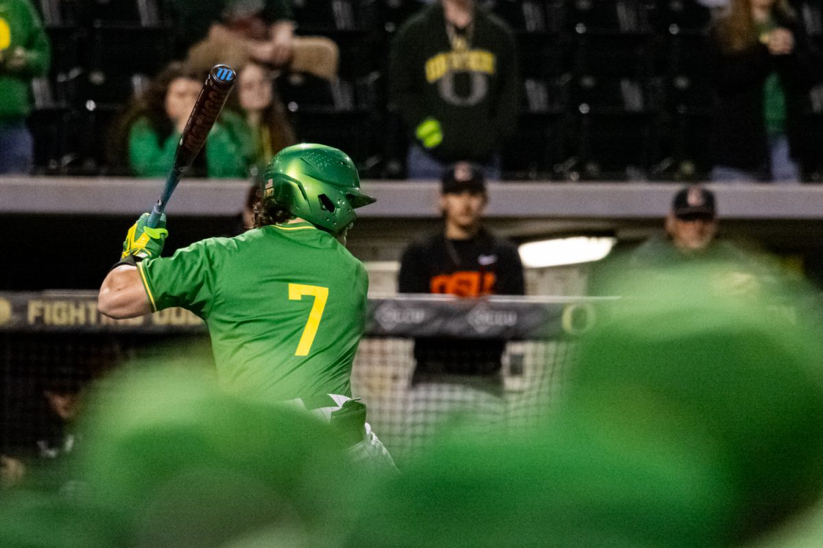 Duck sophomore Jax Gimenez (7) settles into his batting stance as his teammates look on. Oregon Duck baseball hosted in-state rivals the Oregon State Beavers at PK Park in Eugene, Ore. on March 3, 2026, losing 10-6. (Owen Burriss/Emerald)