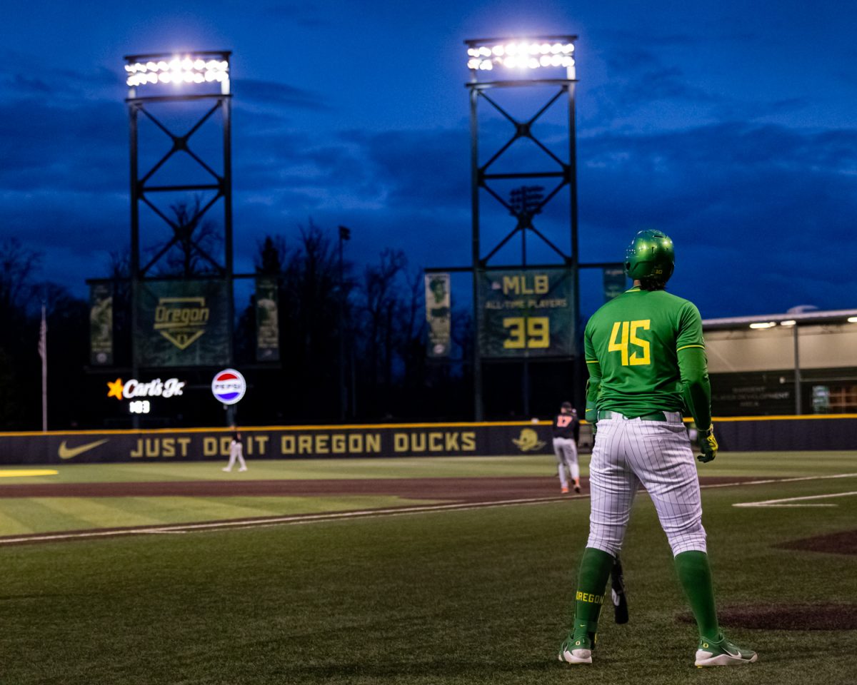 Oregon designated hitter Dominic Hellman (45) watches the game while being on deck to bat. Oregon Duck baseball hosted in-state rivals the Oregon State Beavers at PK Park in Eugene, Ore. on March 3, 2026, losing 10-6. (Owen Burriss/Emerald)