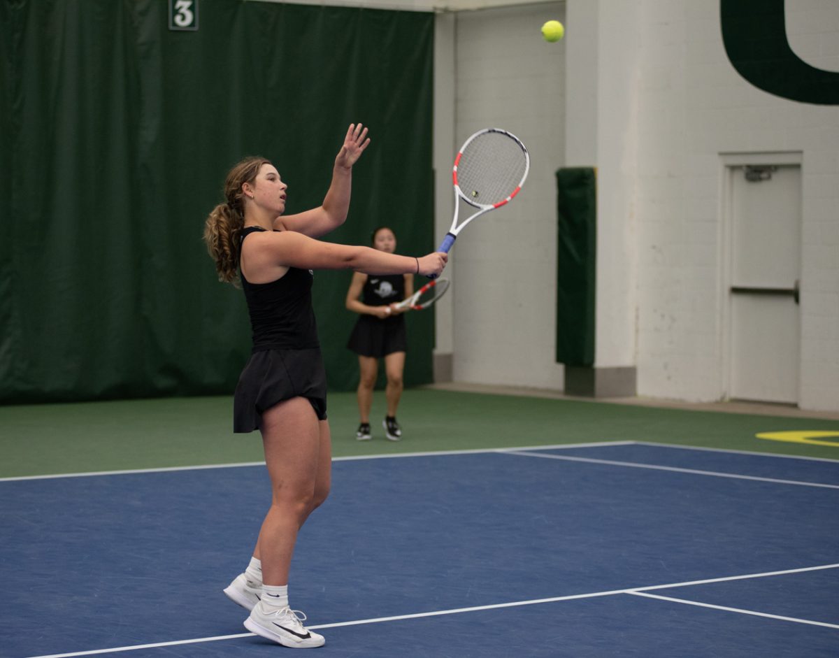 Oregon Duck Juliet Santito makes a shot back to the opposing duo. Oregon Ducks Women's Tennis take on the Maryland Terrapins at the Student Tennis Center in Eugene, Ore. on March 6th, 2026. Oregon would lose 4-2 to Maryland. (Chris Castro/Emerald)