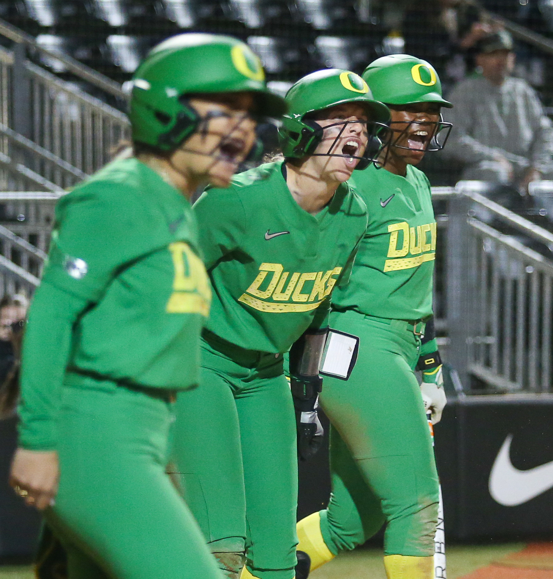 Three Oregon players celebrate Katie Flannery's RBI single. Oregon Ducks Softball take on the Sacramento State Hornets at Jane Sanders Stadium in Eugene, Ore., on Mar. 6, 2026. (Tyler Graham/Emerald)