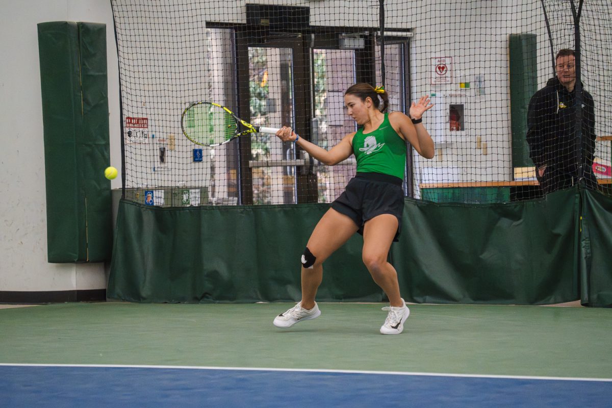 Freshman Virginia Crocker takes a forehand against her opponent. The University of Oregon Women’s Tennis team defeated No. 63 Rutgers University 4-0 on March 8, 2026, in Eugene, Ore. (Lilly Wall/Emerald)