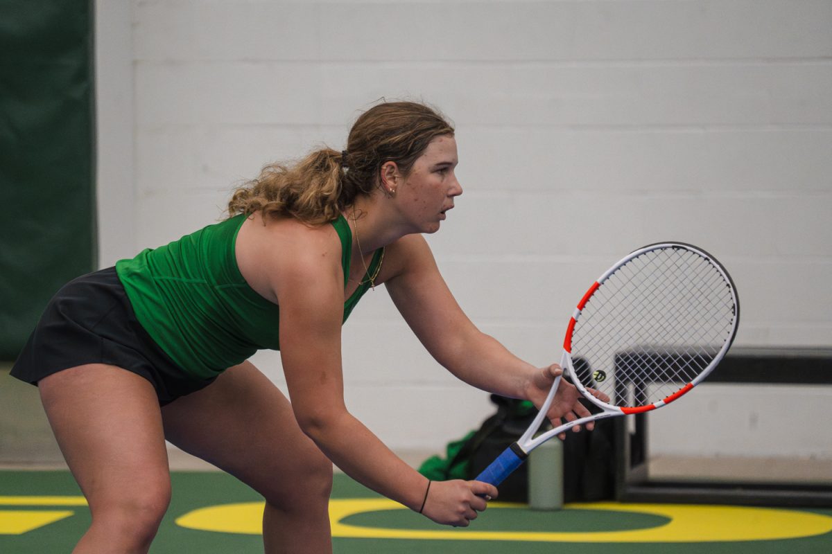 Sophomore Juliet Santitto stands ready for the point to begin. Santitto and freshman Hinata Furutani's win against Rutgers University on March 8, 2026, continued their sixth straight doubles victory. (Lilly Wall/Emerald)