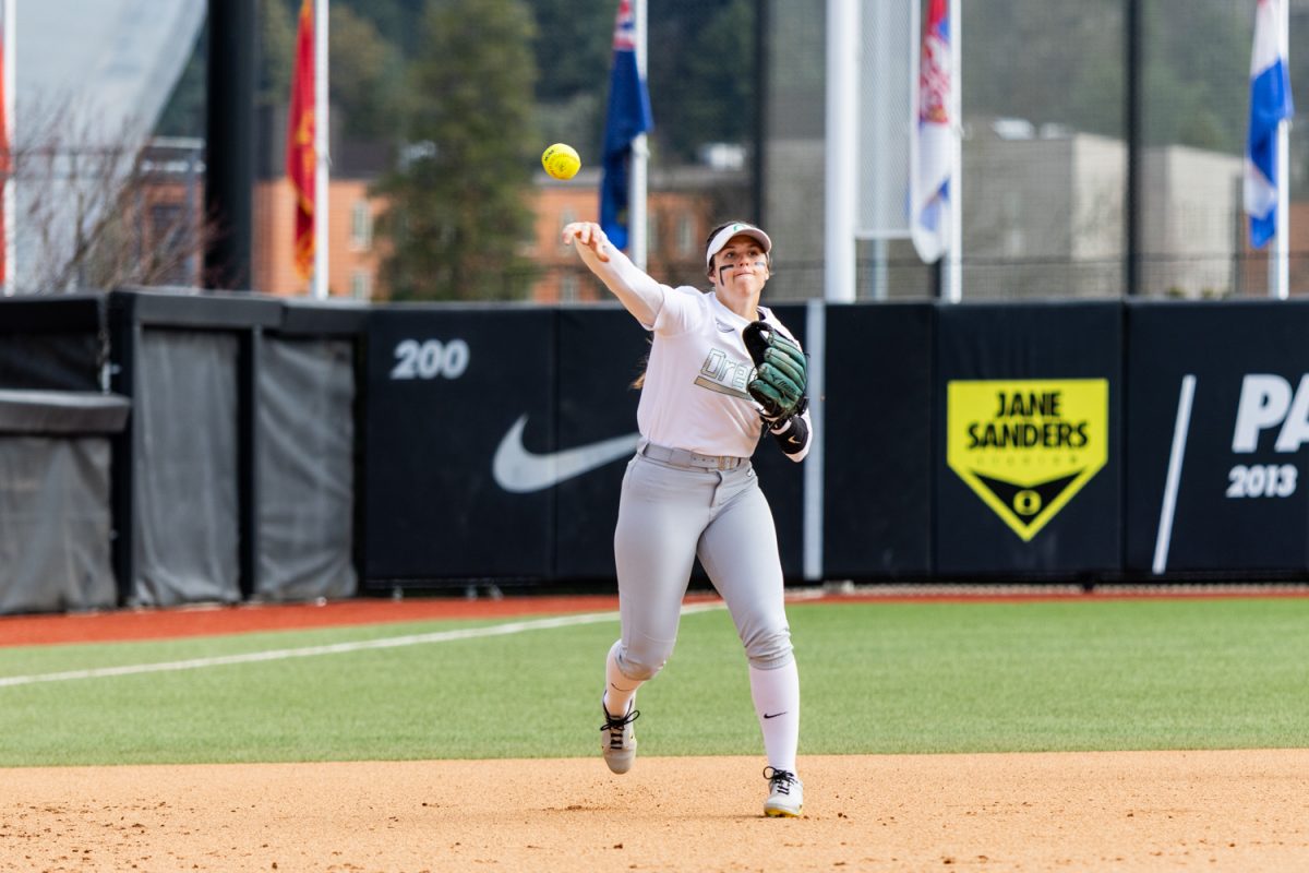Oregon third baseman Katie Flannery throws across the diamond towards first base. Oregon Ducks softball takes on the Nevada Wolf Pack at Jane Sanders Stadium in Eugene, Ore., on March 8, 2026, winning 7-3. (Owen Burriss/Emerald)