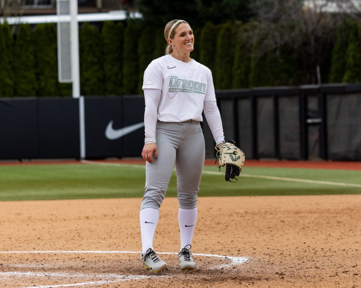 Oregon pitcher Lyndsey Grein (33) smiles towards home plate. Oregon Ducks softball takes on the Nevada Wolf Pack at Jane Sanders Stadium in Eugene, Ore., on March 8, 2026, winning 7-3. (Owen Burriss/Emerald)