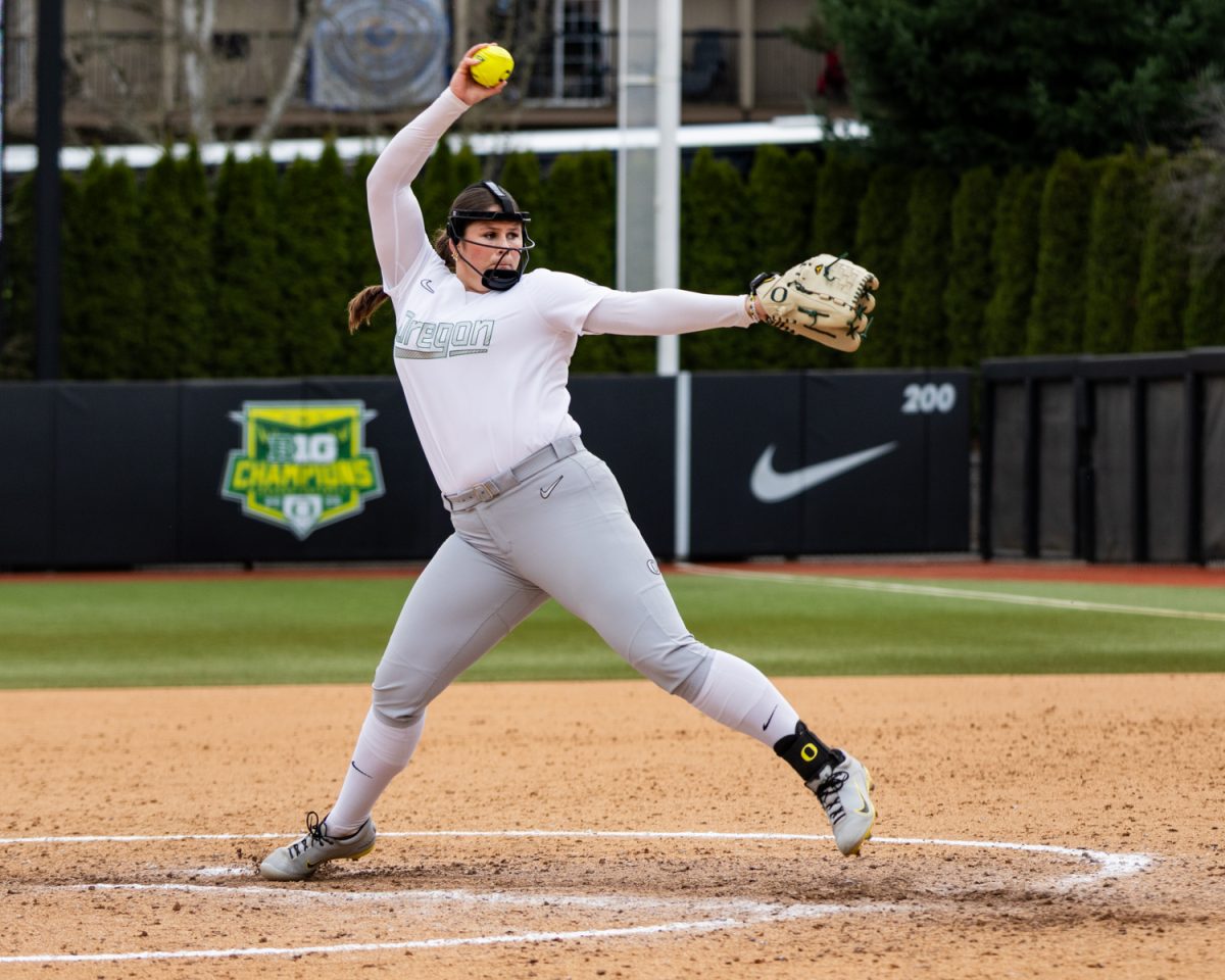Oregon pitcher Maddie Milhorn (22) winds up for a pitch. Oregon Ducks softball takes on the Nevada Wolf Pack at Jane Sanders Stadium in Eugene, Ore., on March 8, 2026, winning 7-3. (Owen Burriss/Emerald)