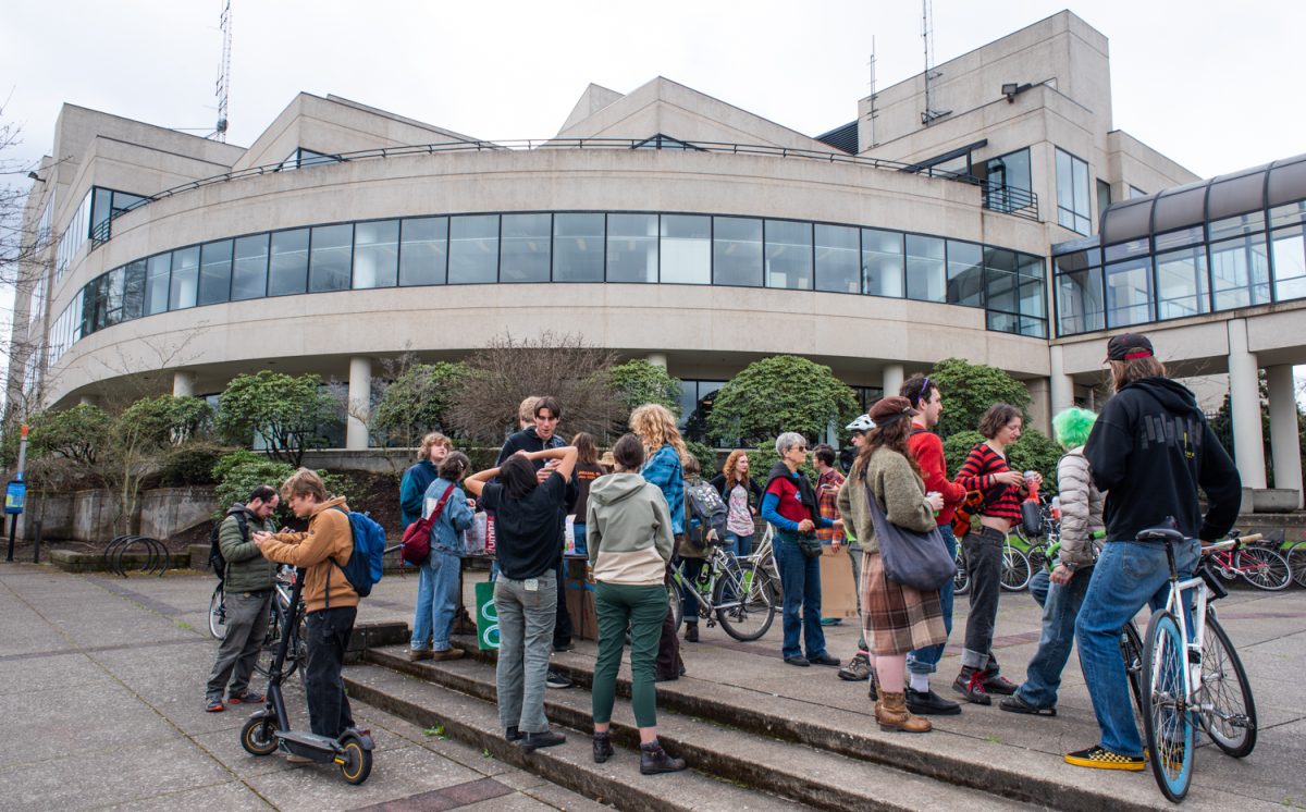 In protest of a new pilot program where the University of Oregon’s power plant would help fill gaps in the EWEB grid with their fossil fuel power, the Fossil Free Eugene Coalition and the Climate Justice League organized a bike ride/rally at the UO central power plant, then city hall, in Eugene, Ore. on March 13th, 2026. (Chris Castro/Emerald)