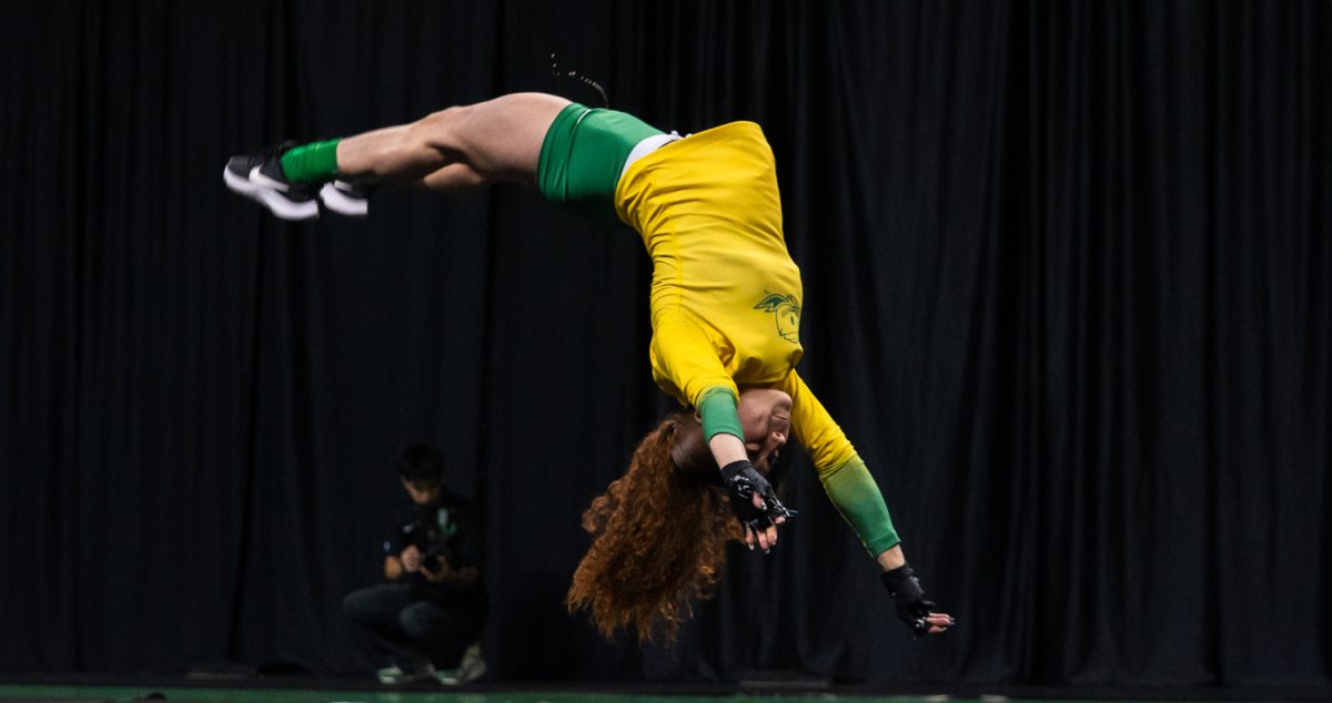 Duck sophomore tumbler Briya Alvarado (25) performs a solo tumbling routine. On March 15,2026 the University of Oregon Ducks Women’s Acrobatics and Tumbling team beat the Gaels in a tight home meet against Iona University at Matthew Knight Arena in Eugene, Ore. (Katie Poluyansky/Emerald).