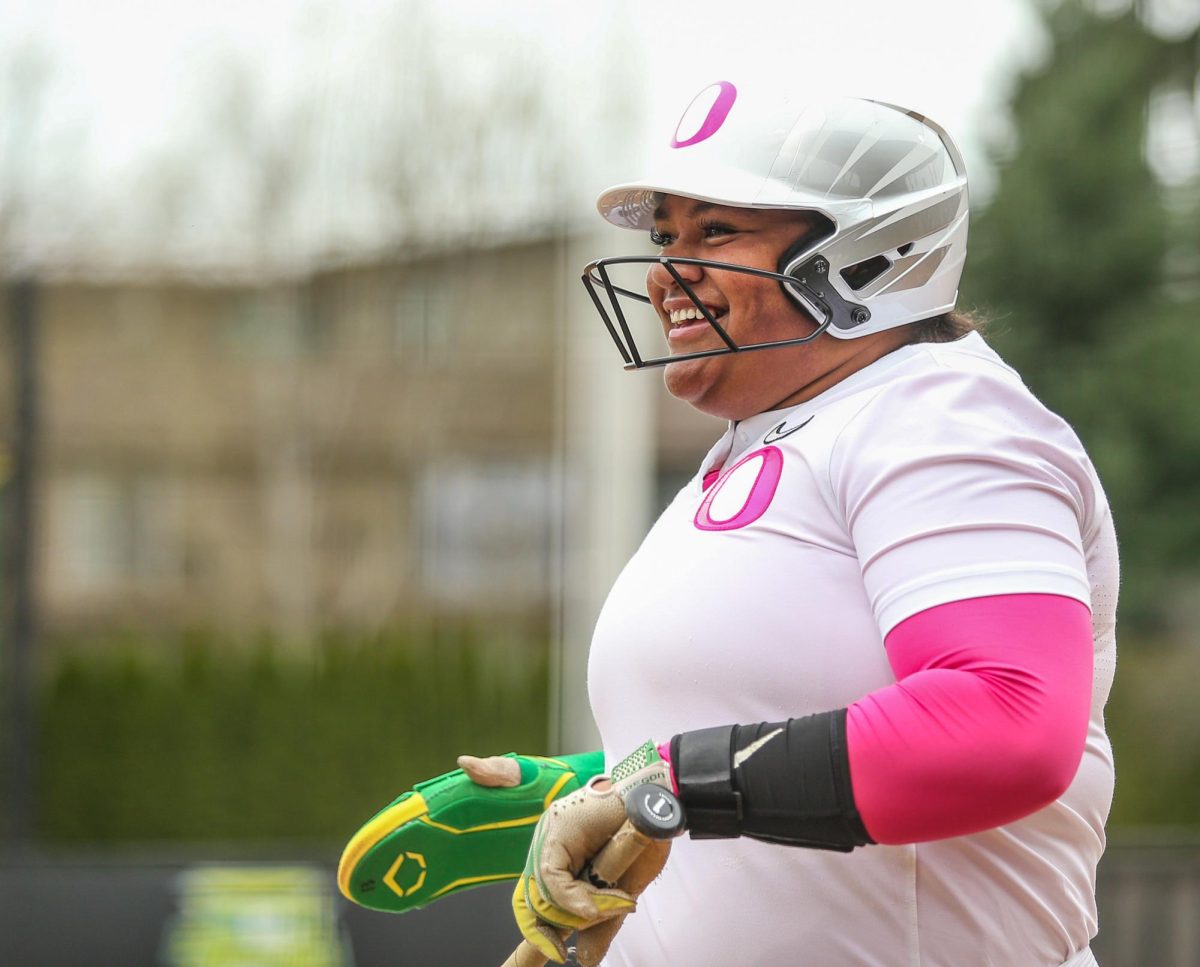 Oregon first basemen Stefini Ma'ake smiles to the dugout after scoring a run. Oregon Ducks Softball take on the Penn State Nittany Lions at Jane Sanders Stadium in Eugene, Ore., on Mar. 15, 2026. (Tyler Graham/Emerald)
