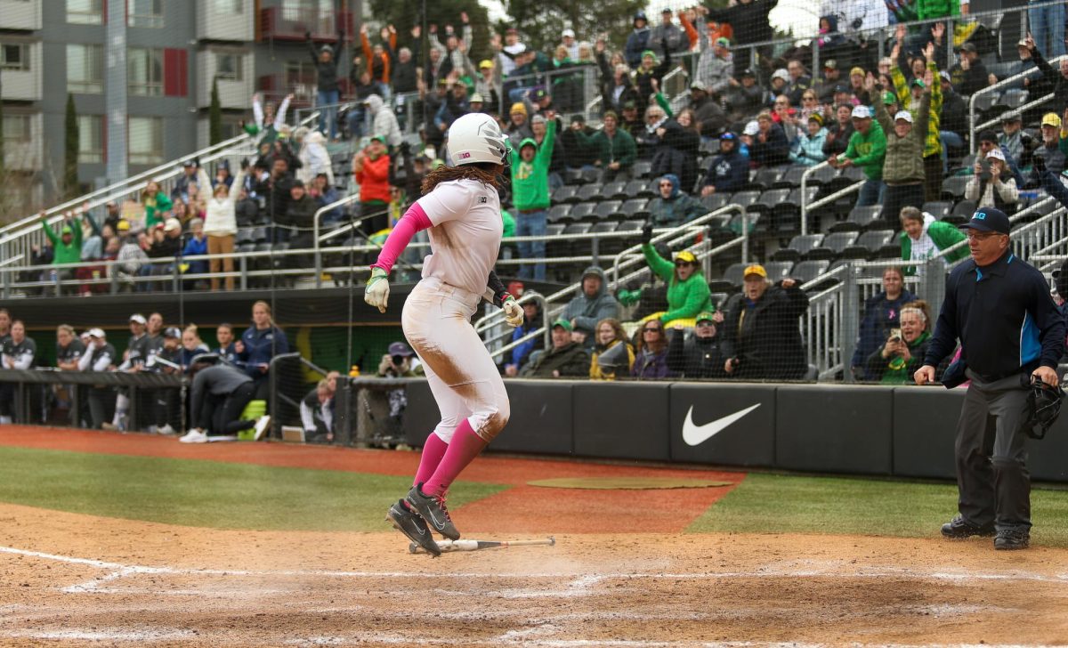 Oregon right fielder Elon Butler (0) leaps into the air after sliding in to score the winning run. Oregon Ducks Softball take on the Penn State Nittany Lions at Jane Sanders Stadium in Eugene, Ore., on Mar. 15, 2026. (Tyler Graham/Emerald)
