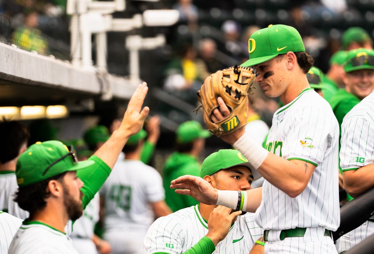 The Ducks high-five each other as they come off the field into the dugout. On March 31st, 2026 the Oregon Ducks Baseball team took on the Portland Pilots at PK Park in Eugene, Ore. (Katie Poluyansky/Emerald)