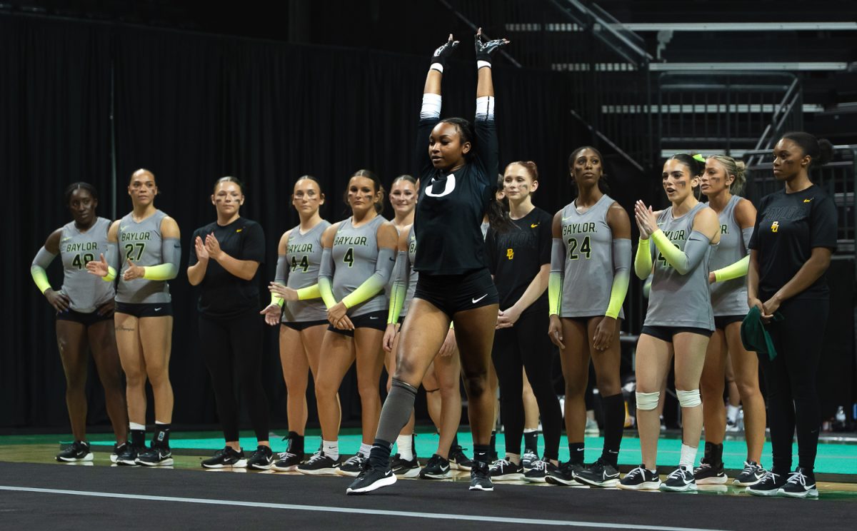 Top/Base/Tumbler Morgan Willgham poses after finishing her pass during the tumbling event. The University of Oregon Acrobatics and Tumbling team took on Baylor University at Matthew Knight Arena in Eugene, Ore., on April 6, 2026, ultimately losing 278.080 to 272.530. (Saj Sundaram/Emerald)