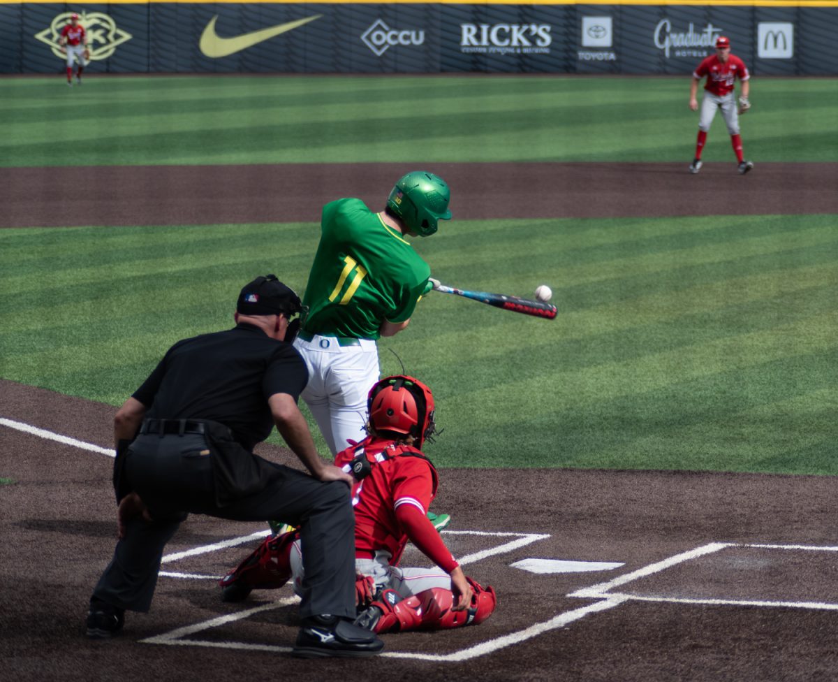 Oregon catcher Brayden Jaksa (11) lands a hit. No.21 Oregon baseball takes on No.19 Nebraska on April 10th, 2026, at PK park, in Eugene, Ore. (Chris Castro/Emerald)