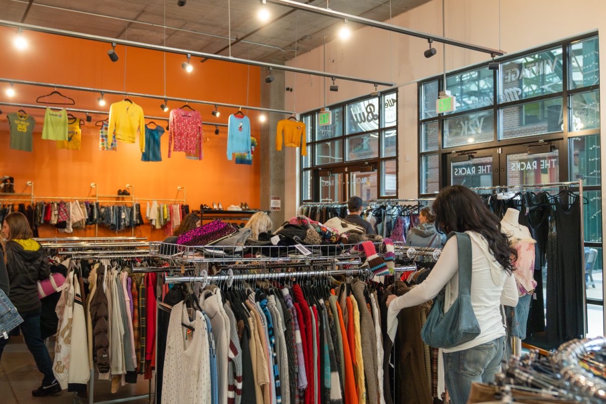 Racks of vintage clothing sit for sale at the entrance of The Racks in Eugene, Ore. The store, which is located inside of the 5th Street Public Market, opened in the fall of 2025. (Lilly Wall/Emerald)