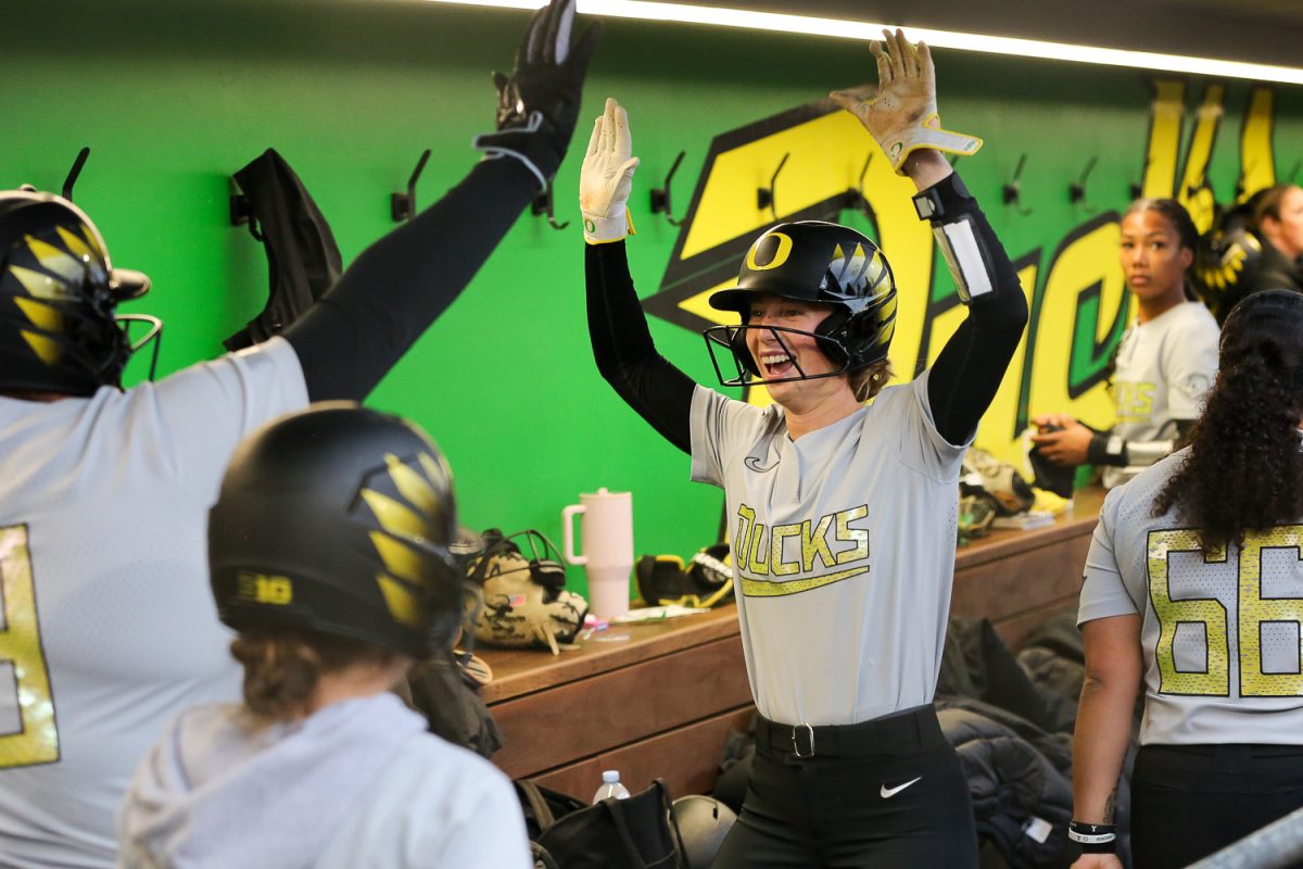 Oregon's Regan Legg (17) cheers in the dugout. Oregon softball faces off against the Oregon State Beavers at Jane Sanders Stadium in Eugene, Ore. on April 22, 2026. (Heidi Thalman/Emerald)