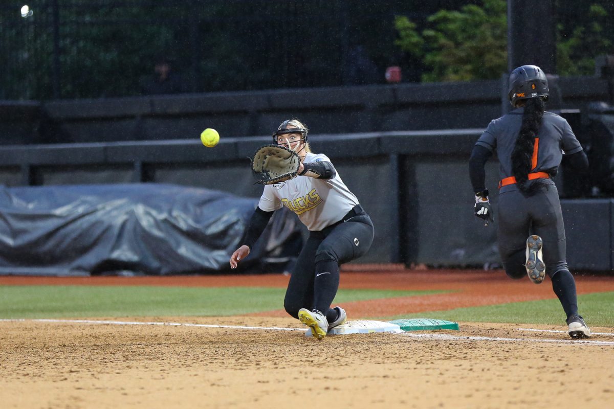 Oregon Duck Rylee McCoy (24) takes another Beaver out. Oregon softball faces off against the Oregon State Beavers at Jane Sanders Stadium in Eugene, Ore. on April 22, 2026. (Heidi Thalman/Emerald)