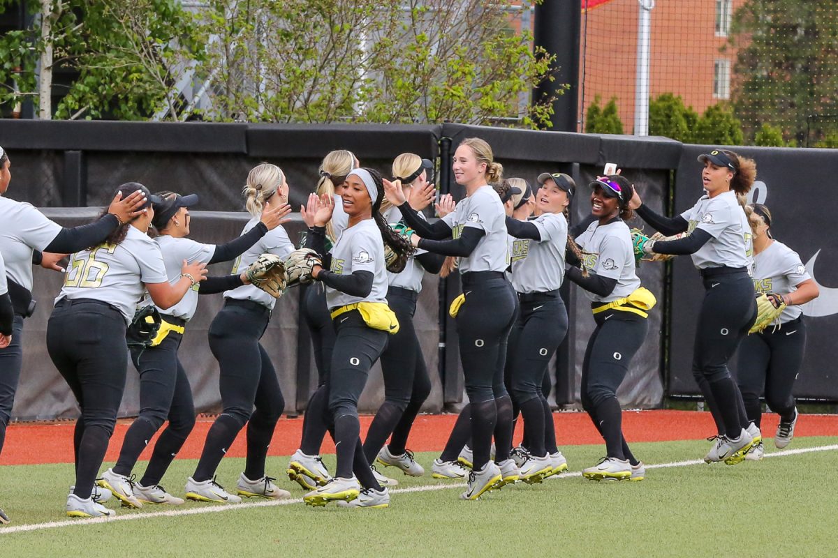 The Oregon Ducks get hype during pregame. Oregon softball faces off against the Oregon State Beavers at Jane Sanders Stadium in Eugene, Ore. on April 22, 2026. (Heidi Thalman/Emerald)