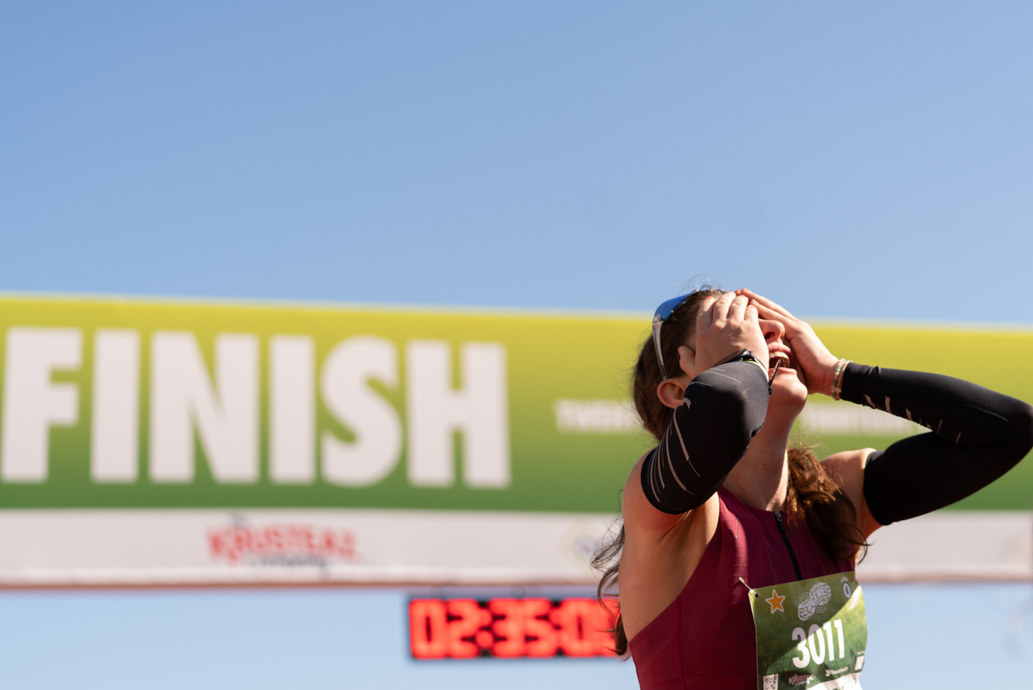 The first female marathon finisher, Amanda Martin, celebrates after successfully crossing the finish line with a time of 02:34:19. The 19th annual Eugene Marathon took place in Eugene, Ore., on Sunday, April 26th, 2026. (Katie Poluyansky/Emerald)