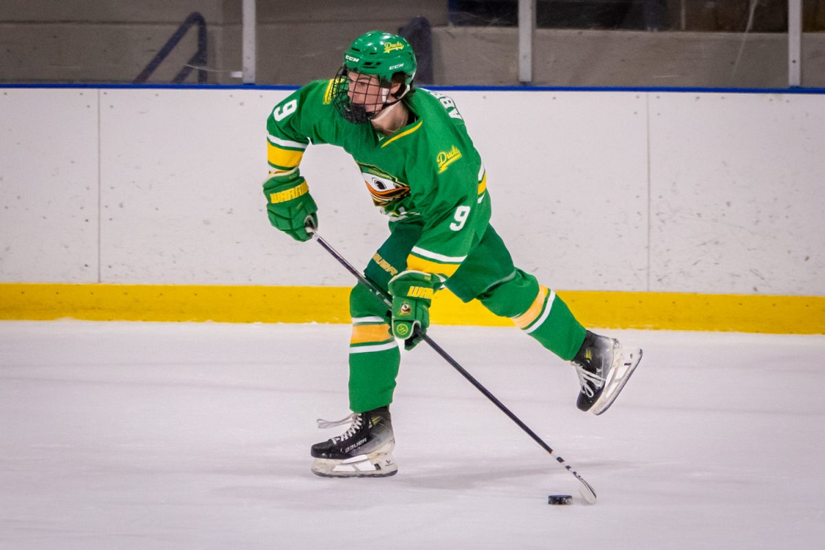 Ducks forward Inde Abresch (9) shoots in the first period. UO Club Hockey hosted its 2026 Spring Game on April 17, 2026 at the Rink Exchange in Eugene, Ore. (Corey Hoffman/Emerald)