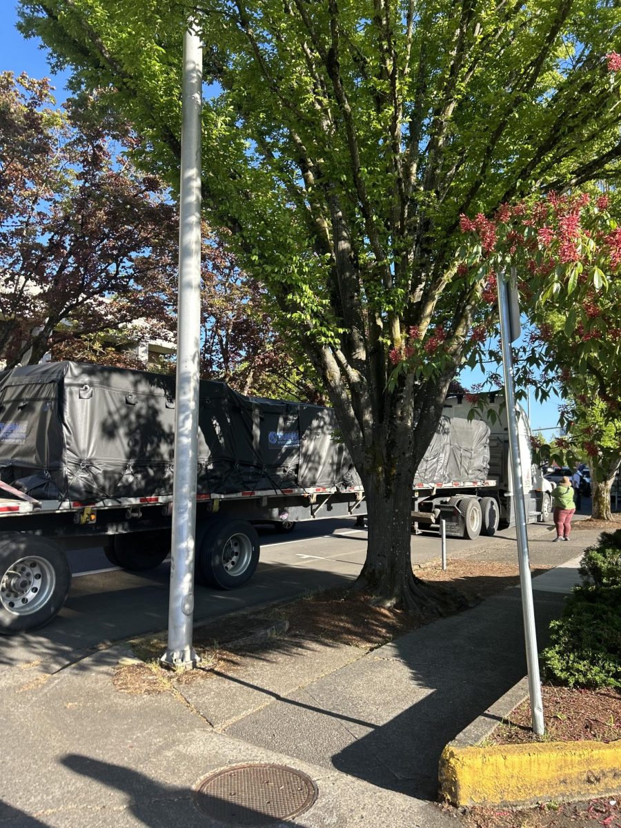A truck with construction materials parks along Pearl Street outside the Eugene Federal Building, where a fence is set to be installed around the perimeter on April 29, 2026. (Corey Hoffman/Emerald)
