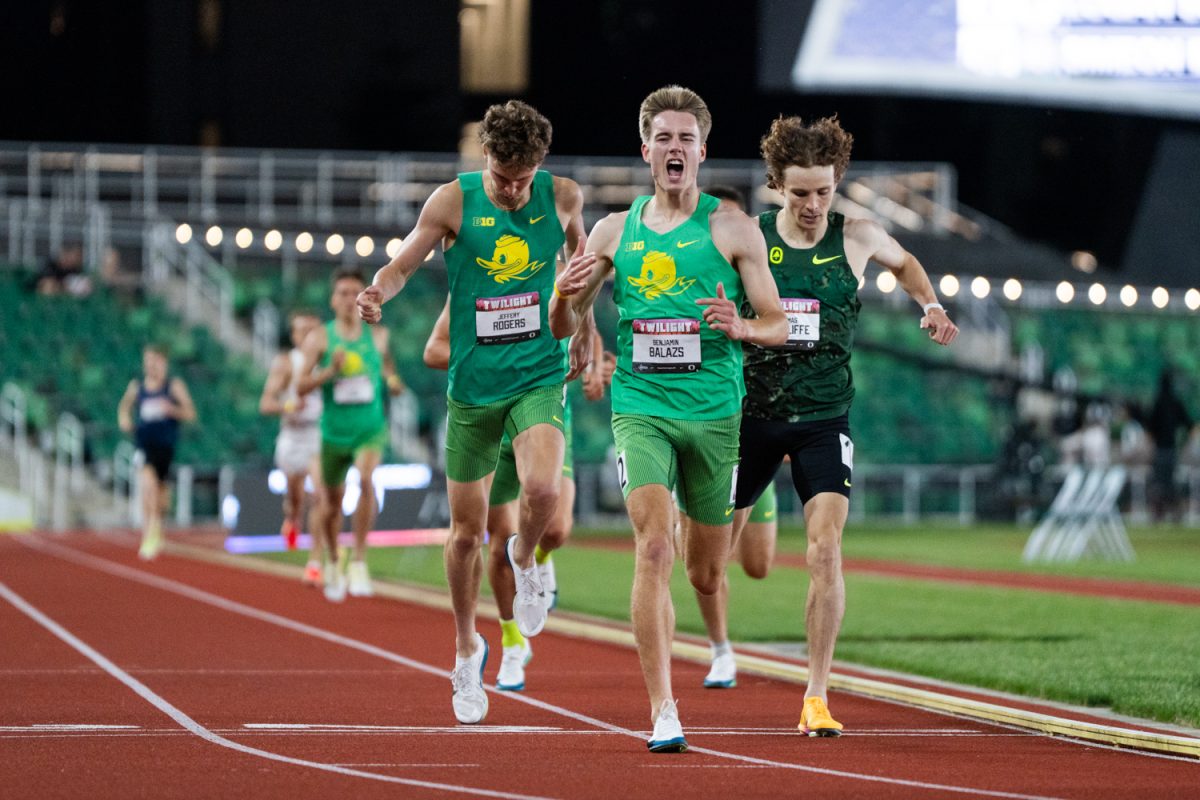 Oregon distance runner Benjamin Balazs yells in celebration of winning the McChesney invite 1500m in a time of 3:36.2. Oregon track and field competes at the Oregon Twilight meet at Hayward Field in Eugene, Ore., on May. 8, 2026. (Rowan Campbell/Emerald).