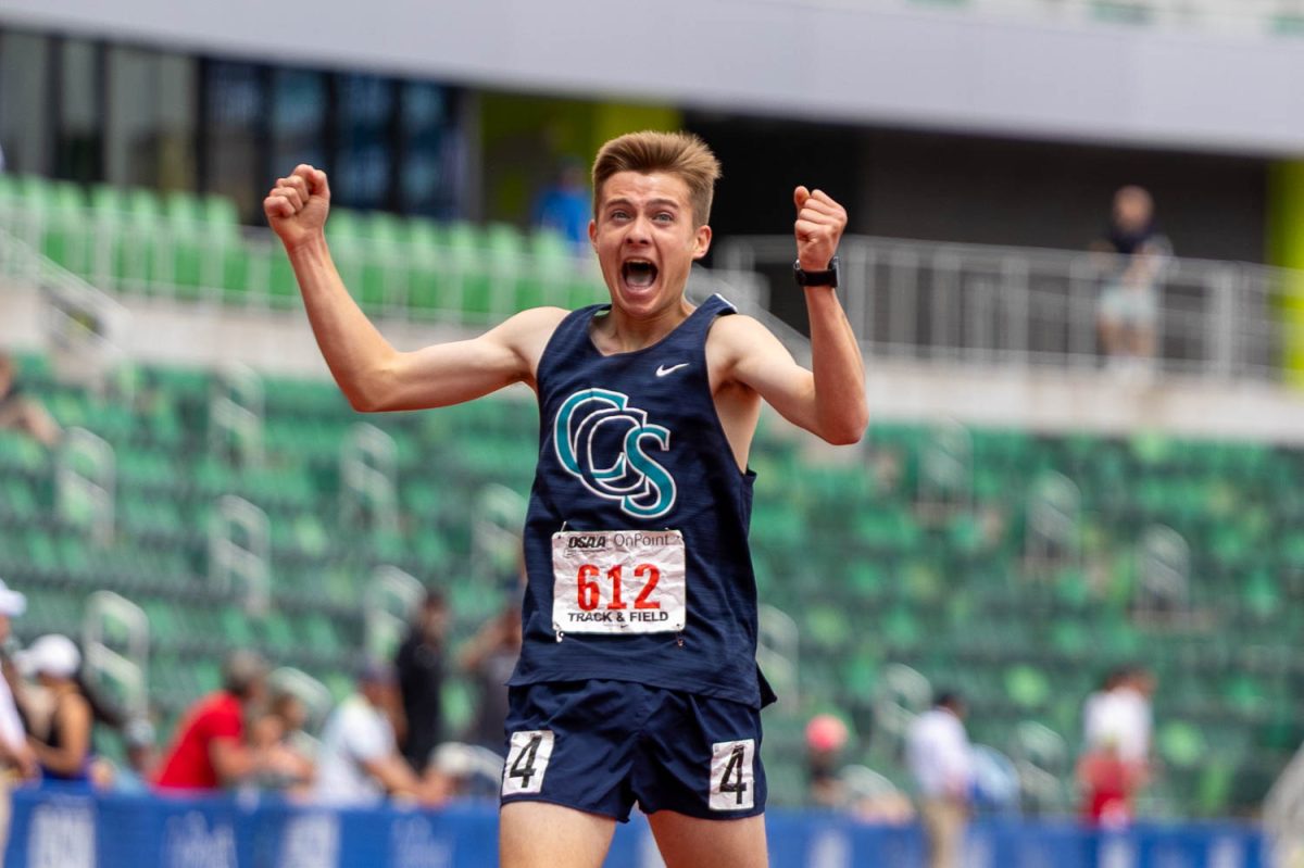 Crosspoint Christian High School freshman Mark Madsen runs across the finish line in celebration as he wins the OSAA 1A 3000m state championship at Hayward Field in Eugene, Ore. on May 28, 2026. (Charlie Mack/Emerald)