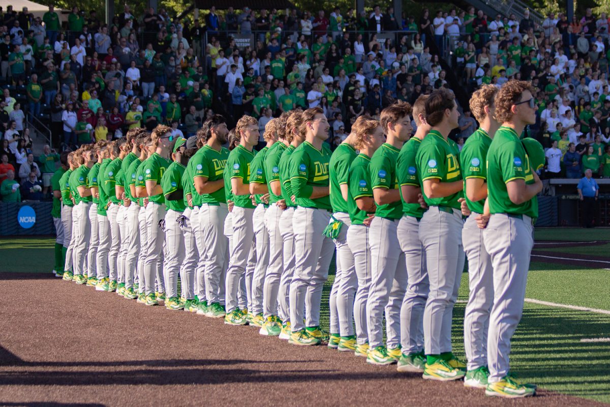 The Oregon baseball team lines up along the first base line for the National Anthem. On May 30, 2026, The Oregon Ducks defeated the Washington State Cougars [4-0] in game 4 of the NCAA D1 Baseball Regional  at PK Park, at University of Oregon, based in Eugene, Ore. (Fred Hall/Emerald)