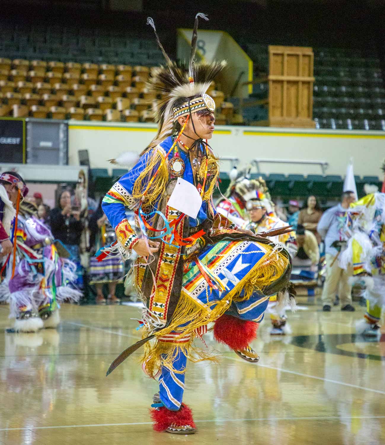 A contestant in the Grass Dance competition dances on day one of the 58th annual Mother’s Day Powwow. The 58th annual Mother’s Day Powwow, presented by UO NASU, was held on May 8,9 and 10, 2026 in McArthur Court in Eugene, Ore. (Corey Hoffman/Emerald)