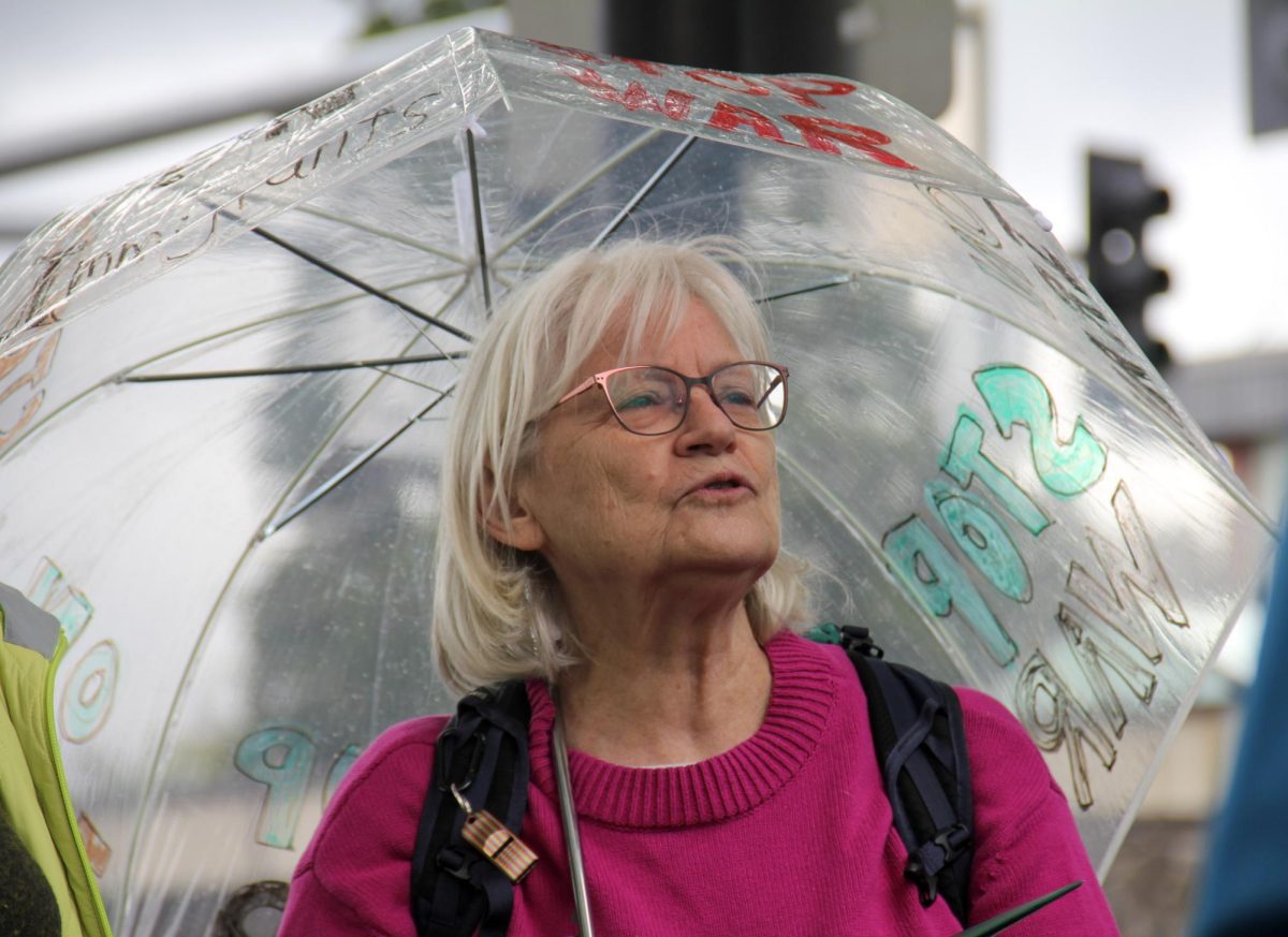 A woman sings during the weekly Singing for Our Lives demonstration outside the Eugene Federal Building on June 4, 2026, in Eugene, Ore. (Tarek Anthony/Emerald)