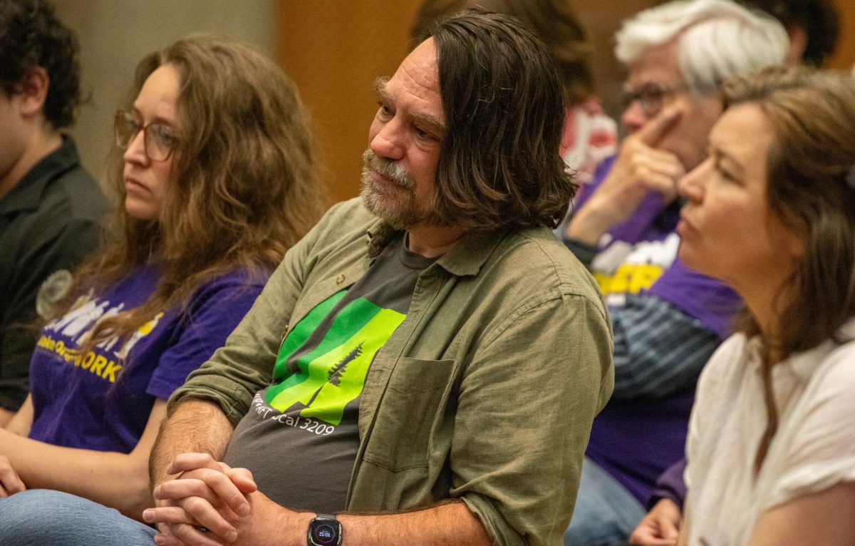 Former United Academics leader Mike Urbancic watches public comment during a University of Oregon Board of Trustees meeting at the Ford Alumni Center on June 2, 2026, in Eugene, Ore. (Tarek Anthony/Emerald)
